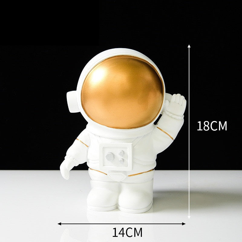 Ornament's style R is an astronaut wearing a gold visor holding hand.