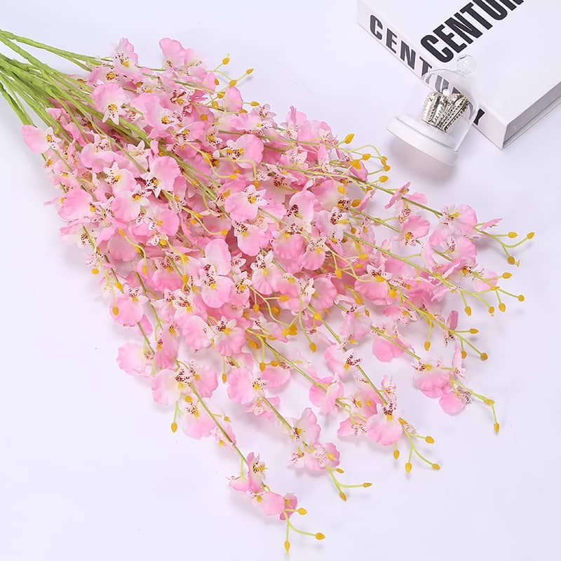 Display for pink dancing orchid artificial flower.