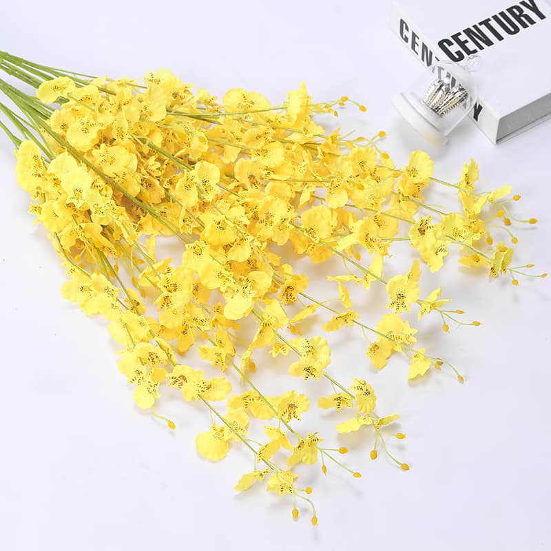 Display for yellow dancing orchid artificial flower.