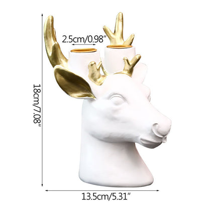 Display for white deer head resin candle holder.
