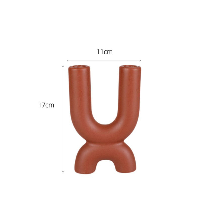 Display for brown 2 holes modern ceramic tube candle holder.