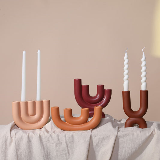 Display for modern ceramic tube candle holder.