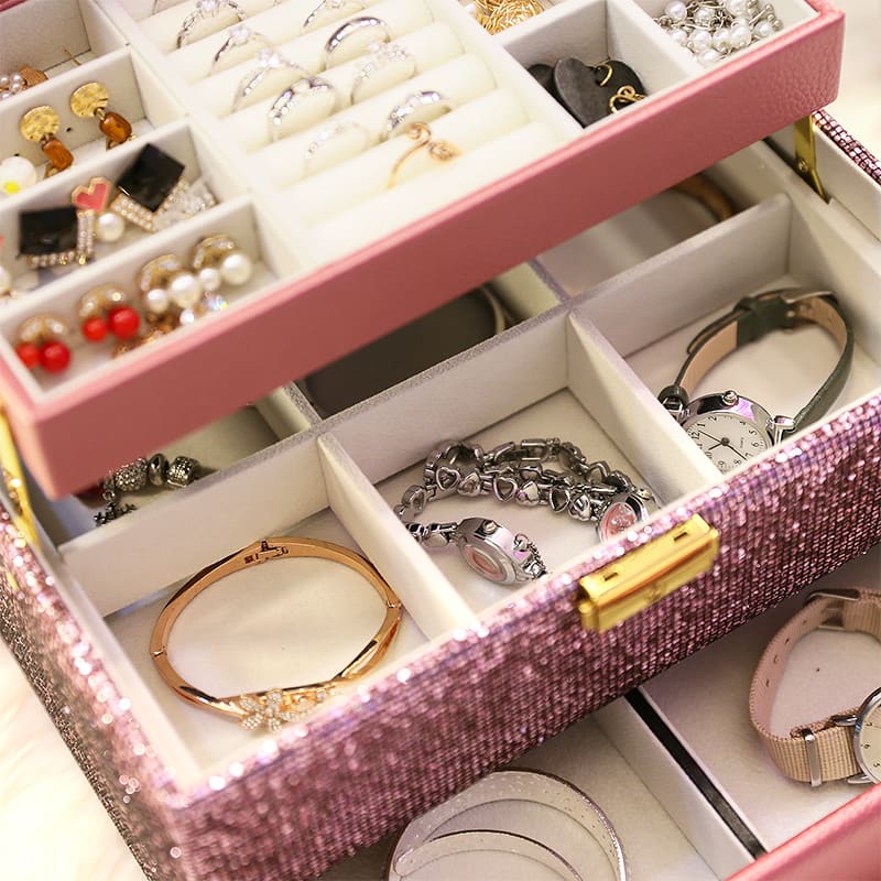 Close-up of interior for pink pu leather and sequins snap on jewelry box.