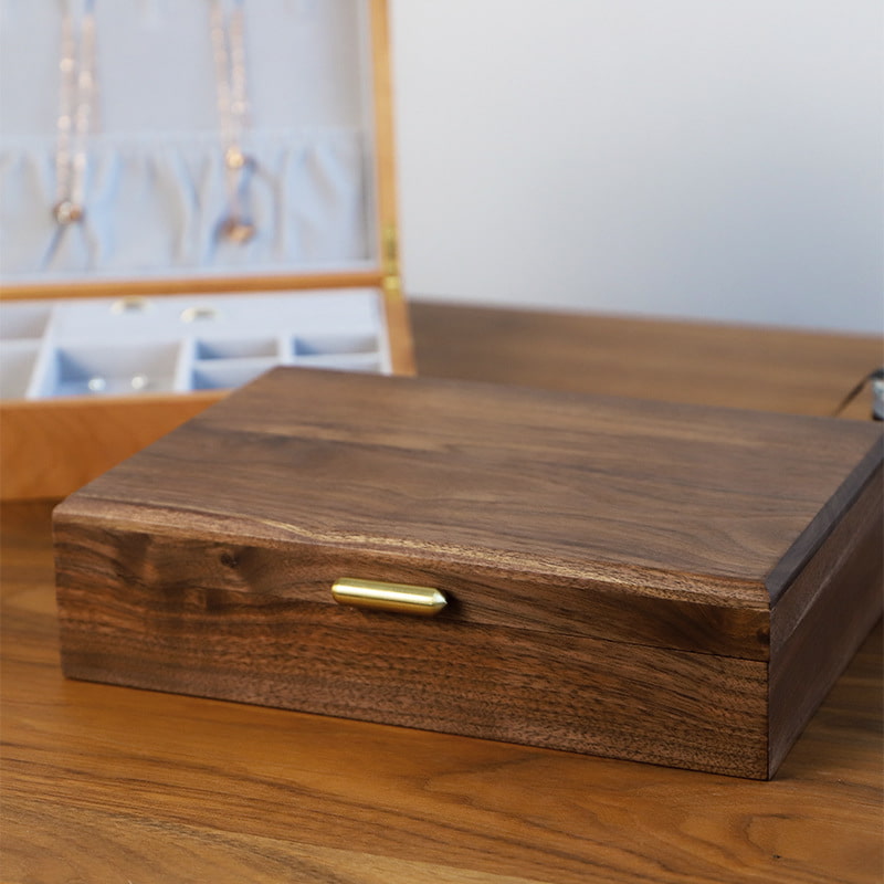 Exterior for black walnut simple wooden snap on jewelry box.