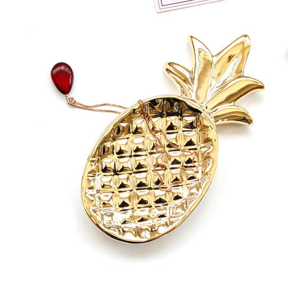 This small pineapple shaped jewelry tray not only puts beloved jewelry, but also other precious small items.