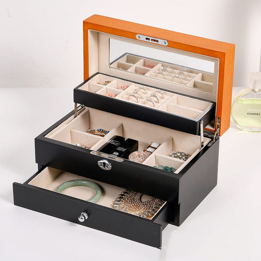 Display for black chic wooden jewelry box with lock and key.