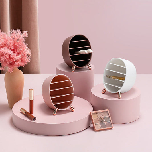 Display for creative cameo brown and white and pink lipstick and eyebrow pencil holder. 