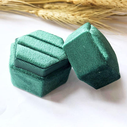 Green fine hexagon velvet ring box with double slot.