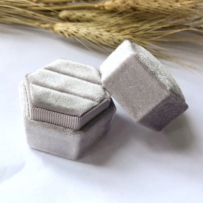 Grey fine hexagon velvet ring box with double slot.