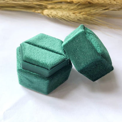 Green fine hexagon velvet ring box with single slot.