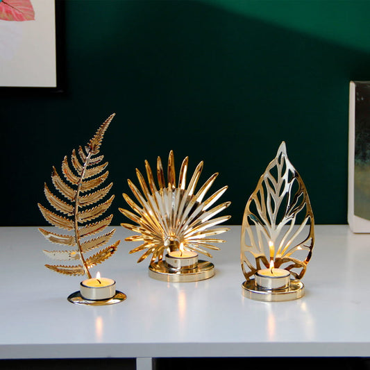 Display for A and B and C gold leaf metal candle holder.