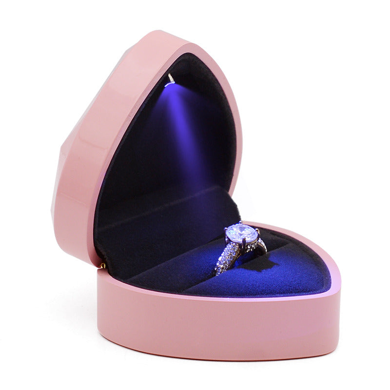 elegant wedding diamond ring in red heart jewelry box on beautiful pink  rose petal background close up Stock Photo | Adobe Stock