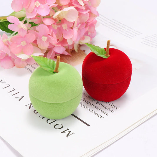 Display for lovely green and red apple ring boxes.