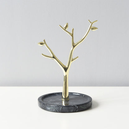 Gold metal tree-shaped jewelry stand tower with black marble base.