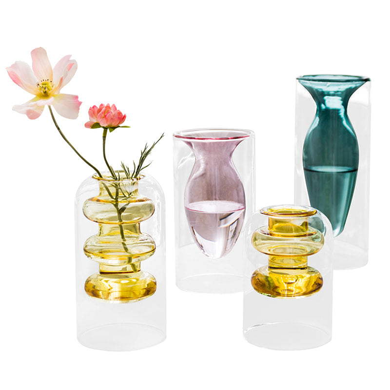 Display for yellowA and yellowB and light pink and peacock blue modern colored glass vase.