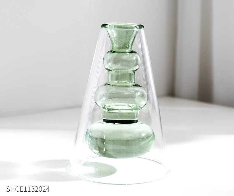 Display for light green modern colored glass vase.