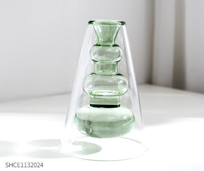 Display for light green modern colored glass vase.
