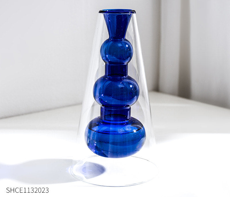 Display for sapphire blue modern colored glass vase.