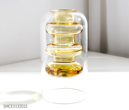 Display for yellowB modern colored glass vase.