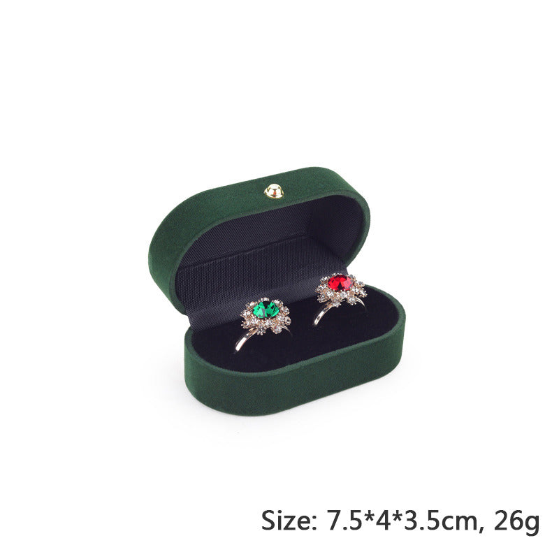 Green and black pair of wedding proposal ring box.