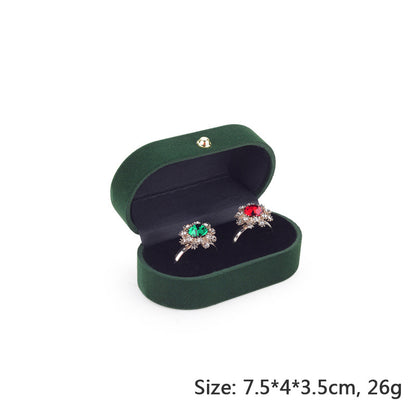 Green and black pair of wedding proposal ring box.