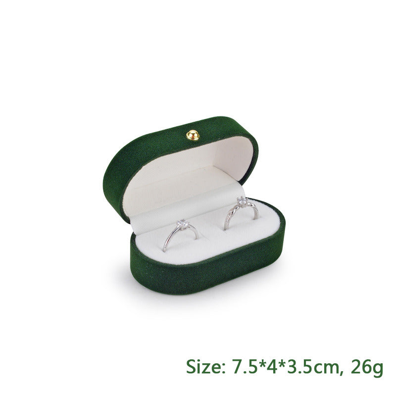 Green and white pair of wedding proposal ring box.