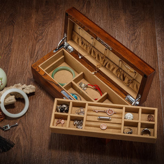 Display for wooden 2-tier beige jewelry box with lock and key.