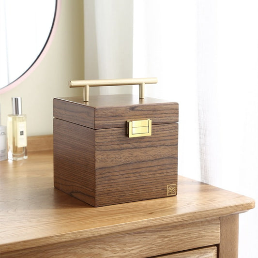 Exterior for classical wooden snap on jewelry box with mirror and handle.