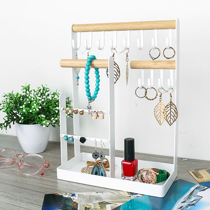 Display for white wrought iron art hook jewelry stand tower.